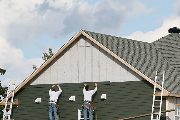 Professional Storm Damage Siding Repair technician working in Vintondale, PA